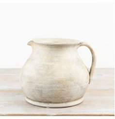 Charming terracotta vase with a cozy, earthy hue.
