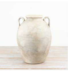 Add rustic charm to your space with this handcrafted terracotta vase
