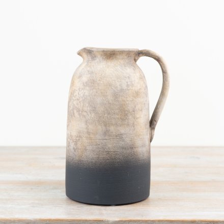Rustic jug perfect for displaying fresh or dried flowers.