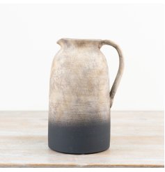 Rustic jug perfect for displaying fresh or dried flowers.