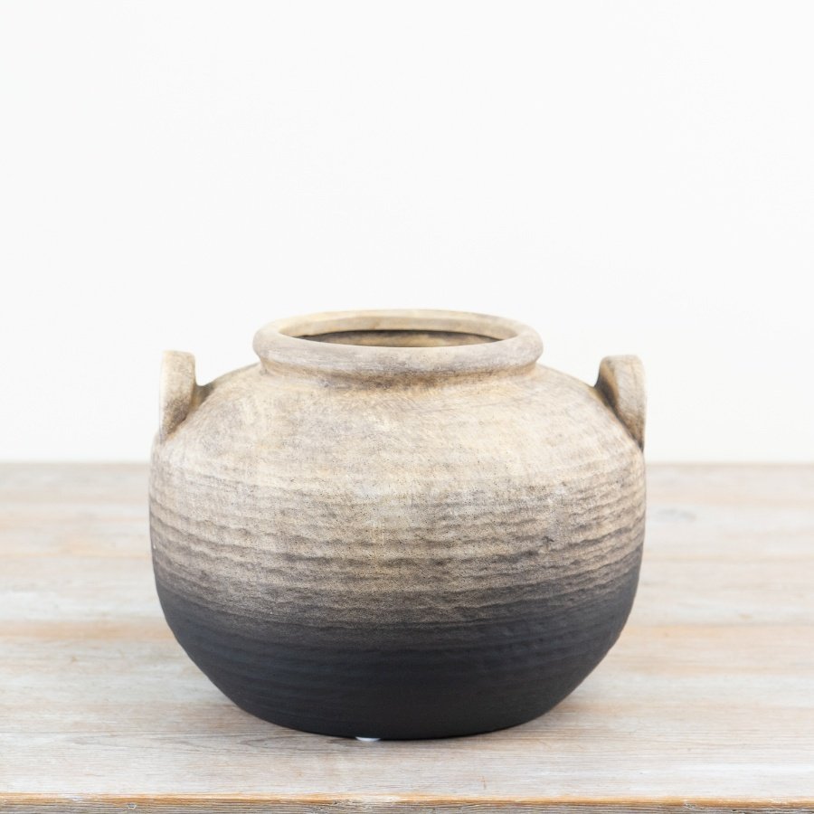 A beautifully textured artisan vase with an ombre black and natural finish. 