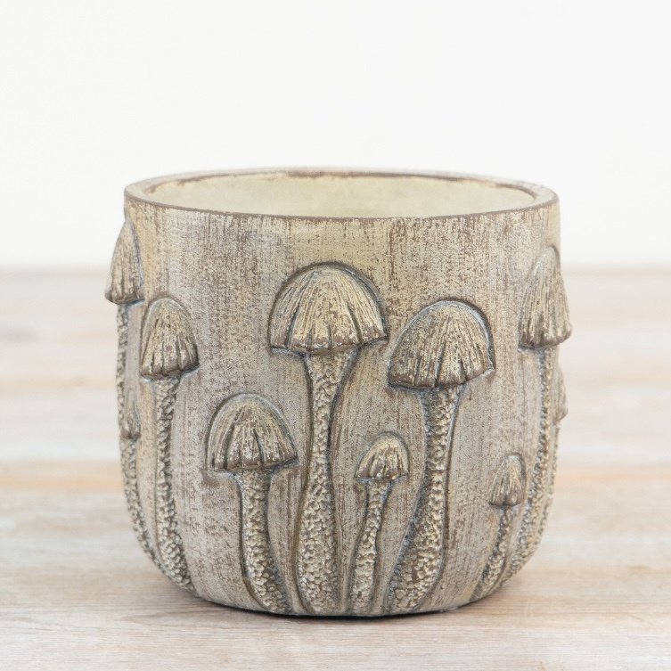 Charming rustic toadstool planter for a whimsical touch to your greenery.