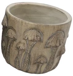 Add charm to your decor with our chic and rustic stone planter, ideal for displaying small plants or herbs.
