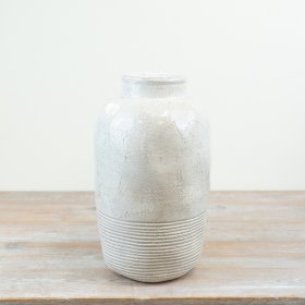 Add a touch of elegance to your decor with a sleek and chic tall vase.