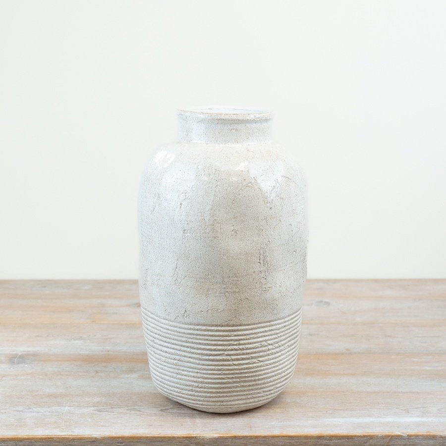 Add a touch of elegance to your decor with a sleek and chic tall vase.