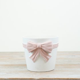 Stylish bow-shaped planter featuring beautiful pink and white hues.