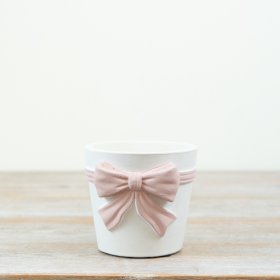 This chic pink and white bow planter makes a stylish statement in any space.