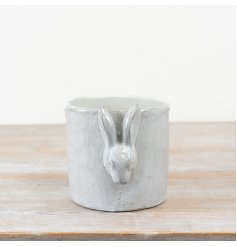 Add a charming touch to your spring décor with this White Cement Glazed Planter