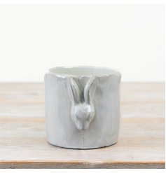 A delightful glossy 3D ceramic planter with charming design.