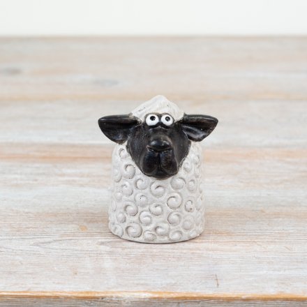 Bring rustic charm home with this 8cm black & white sheep figurine, perfect for a cozy countryside vibe.