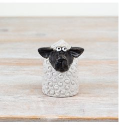 Bring rustic charm home with this 8cm black & white sheep figurine, perfect for a cozy countryside vibe.