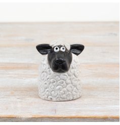 Bring cozy charm to any room with this cute 14cm sheep ornament.