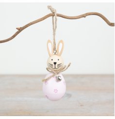 Add charm to your decor with this adorable pink rabbit, a sweet and stylish addition to any living space. 
