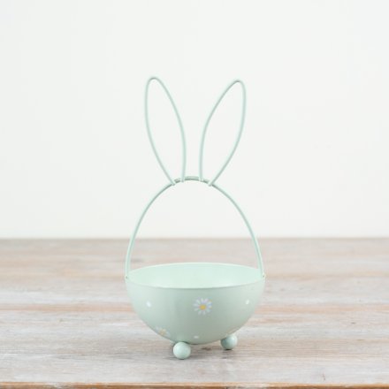 A chic egg shaped metal basket with bunny ears and a painted daisy design. 