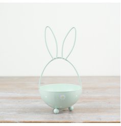 A chic egg shaped metal basket with bunny ears and a painted daisy design. 