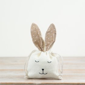 Keep your chocolate goodies secure in this charming bunny bag, featuring a convenient drawstring closure.
