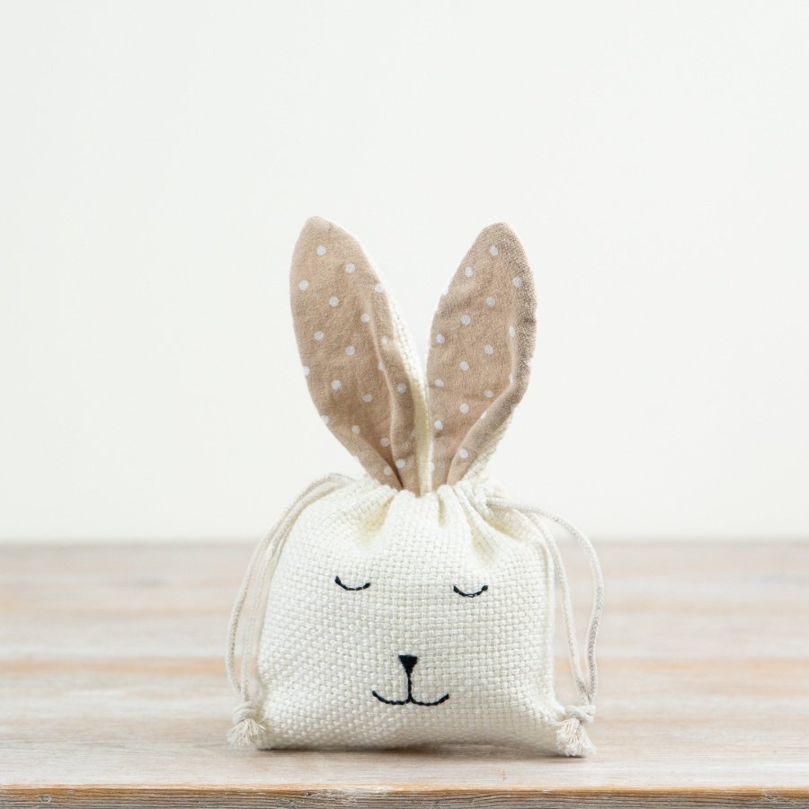 Keep your chocolate goodies secure in this charming bunny bag, featuring a convenient drawstring closure.