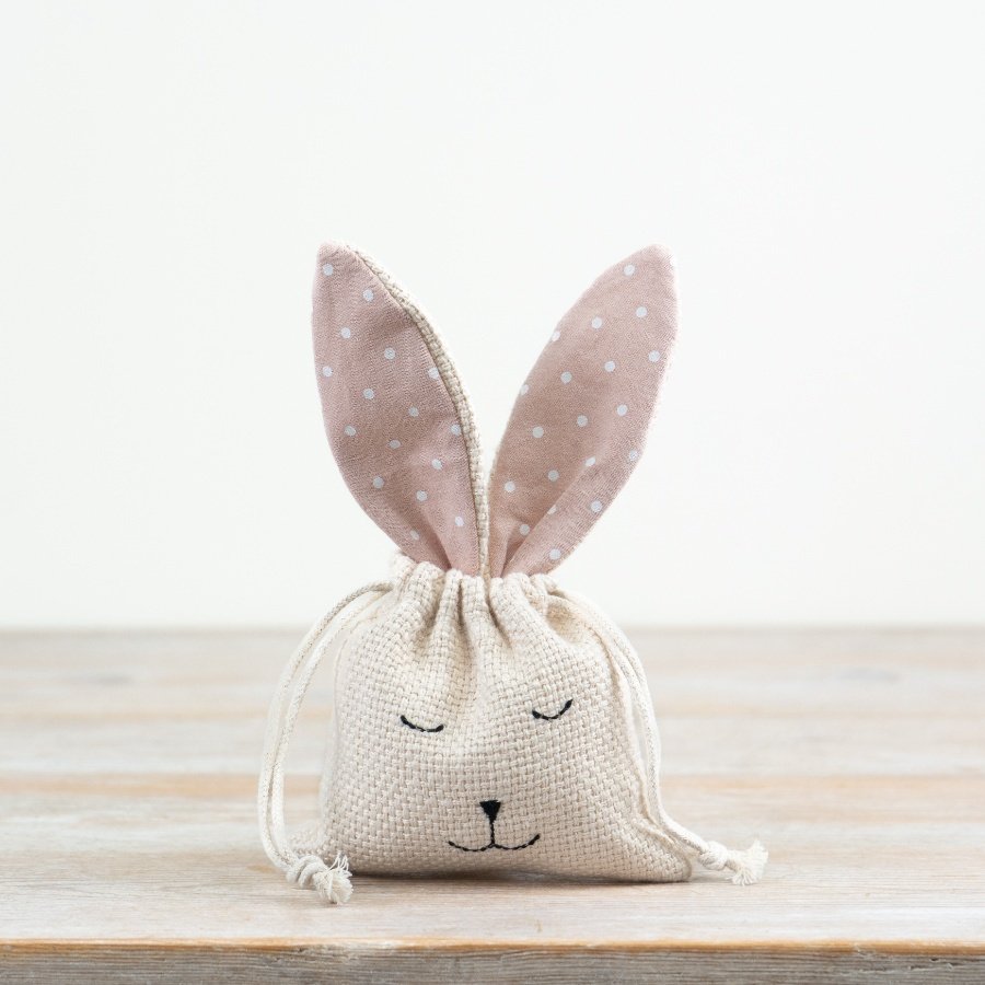 A mix of 2 unique drawstring gift bags with polka dot bunny ears and charming stitched faces.