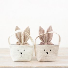 Hop into spring with this charming Fabric Rabbit Bag! Featuring soft pink ears and a delicate bow