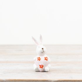 Add a touch of spring charm with this glazed white Ceramic Rabbit with Daisy