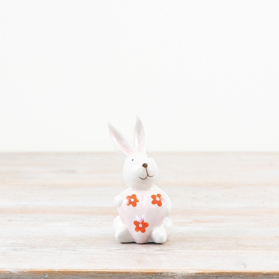 Add a touch of spring charm with this glazed white Ceramic Rabbit with Daisy