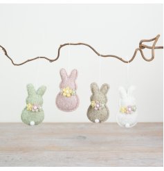 Bring a playful charm to your spring and Easter decorations with this delightful piece.