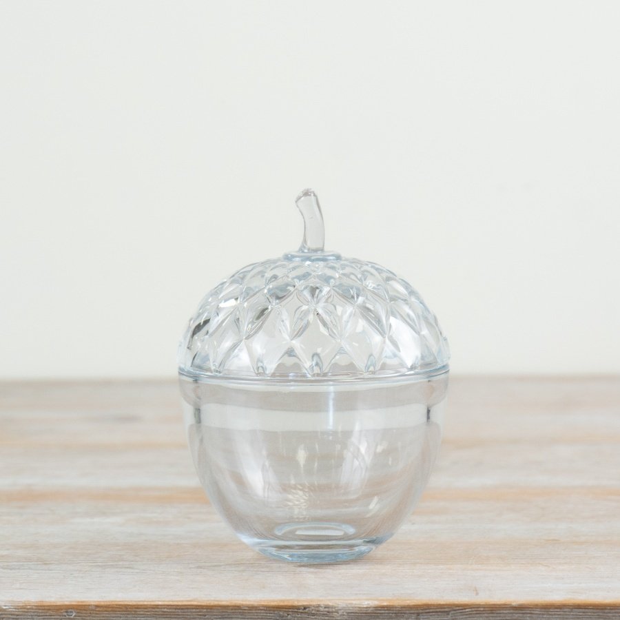 Crafted from clear glass, this delicate acorn pot adds a charming touch to any Autumn table centerpiece.