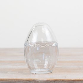 Egg-shaped jar with clear standing design perfect for display or storage.