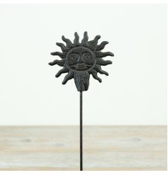 Rustic garden stake showcasing a smiling sunshine with a bright, cheerful face.
