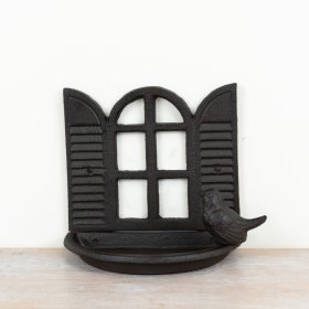 Rustic cast iron bird feeder showcasing a charming open window design.