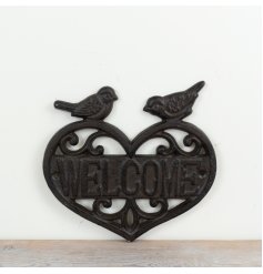 Cast iron rustic welcome sign showcasing a charming heart-shaped design.