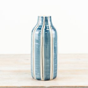 Handcrafted ceramic vase features a unique design, perfect for adding a chic touch to your home décor. 