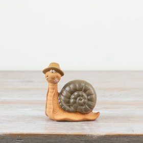 Whimsical snail figurine with a playful hat