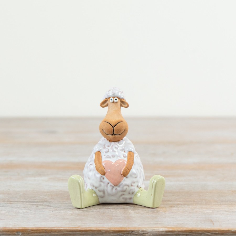 A beautiful Spring piece to enhance your display collection.