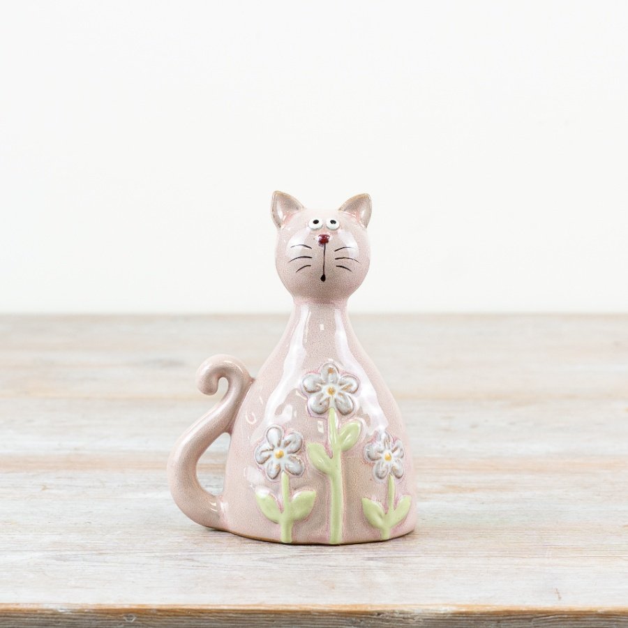 Pastel pink cat with daisy designs, coated in a shiny clear glaze.