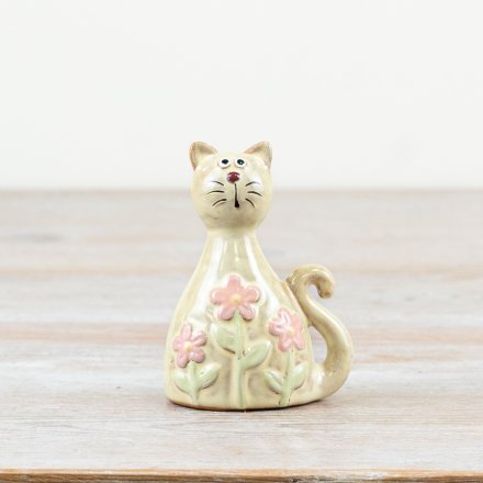 Glossy pastel green cat adorned with daisy patterns and a sleek clear glaze finish.