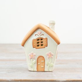 Charming fairy house Spring tealight holder, adding magic and glow to your decor.