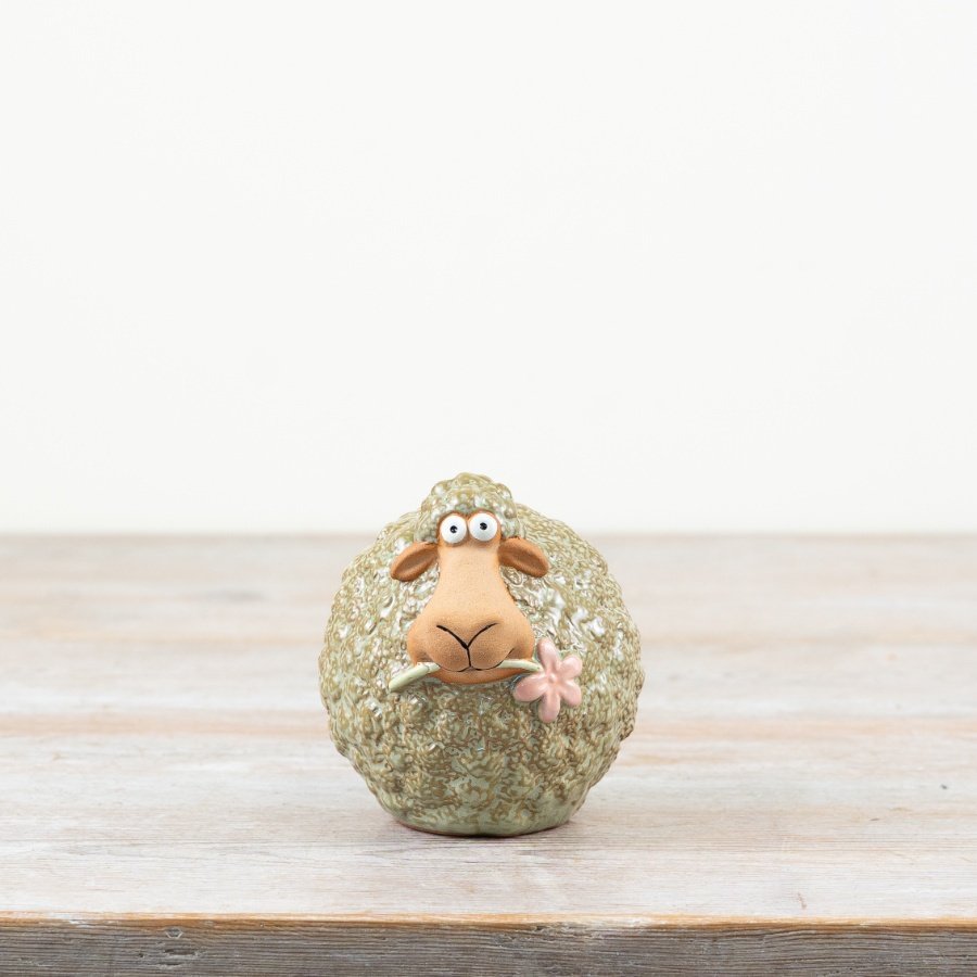 Bring charm and whimsy to your decor with this delightful Green Sheep Flower Ornament.
