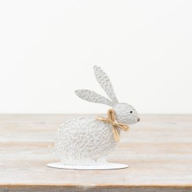 Enhance your décor with this charming textured metal rabbit accent.