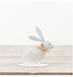 Enhance your decor with this charming textured metal rabbit accent.