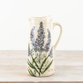 A charming rustic jug featuring elegant lavender artwork with a glazed finish.