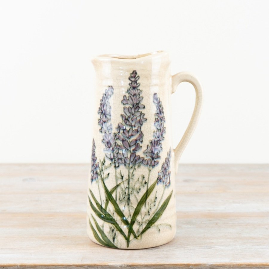 A charming rustic jug featuring elegant lavender artwork with a glazed finish.
