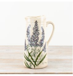 A rustic glazed jug displaying beautiful lavender illustrations.