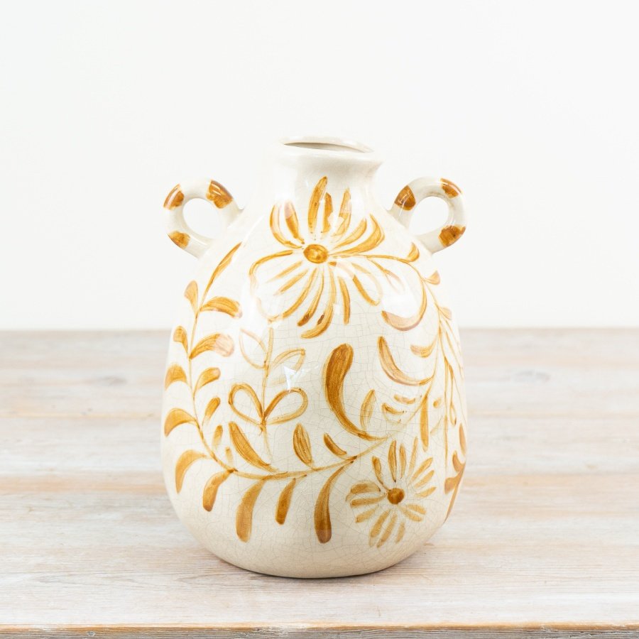 Charming vase featuring a floral pattern and two elegant handles.