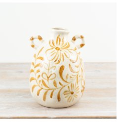 a lovely flower design vase with 2 handles 