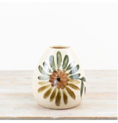 A lovely vase featuring an elegant floral pattern.
