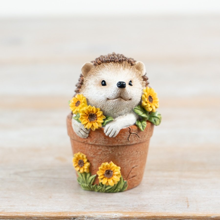 Discover the charming Hedgehog In Plant Pot Decor, your must-have garden companion!