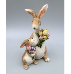 Honor two special occasions with our cute Mum & Child Bunny Decor featuring festive Easter flowers.