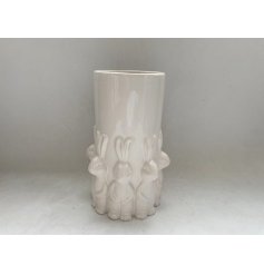 Elegant Easter vase featuring standing rabbits and a smooth white glazed surface, perfect for spring decor.