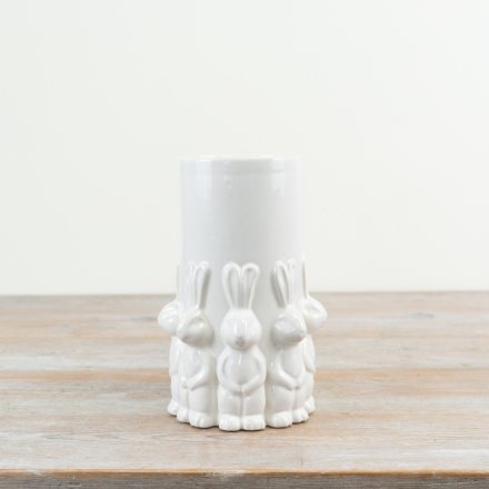 Elegant Easter vase featuring standing rabbits and a smooth white glazed surface, perfect for spring decor.